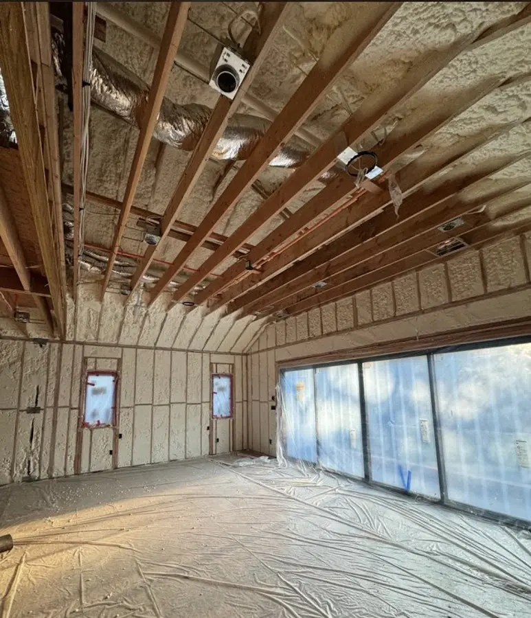 Interior walls and ceiling insulated with spray foam during new construction in Old Fig Garden